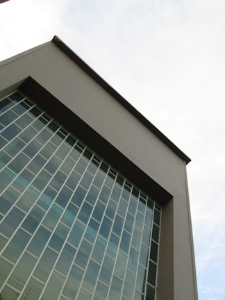 An exterior view of a contemporary building with large windows.