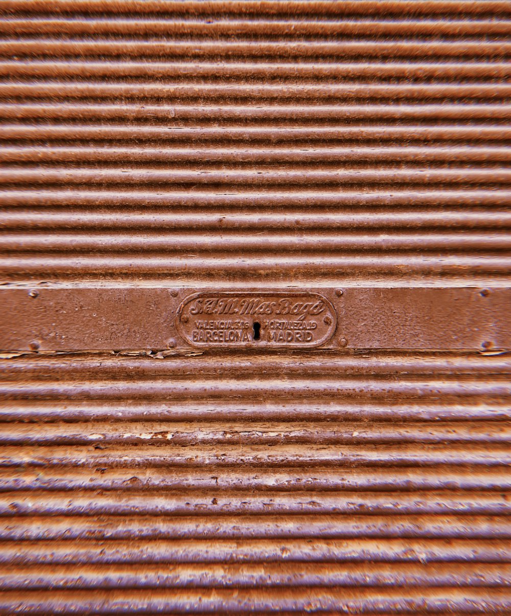 brown wooden door with black metal door lever