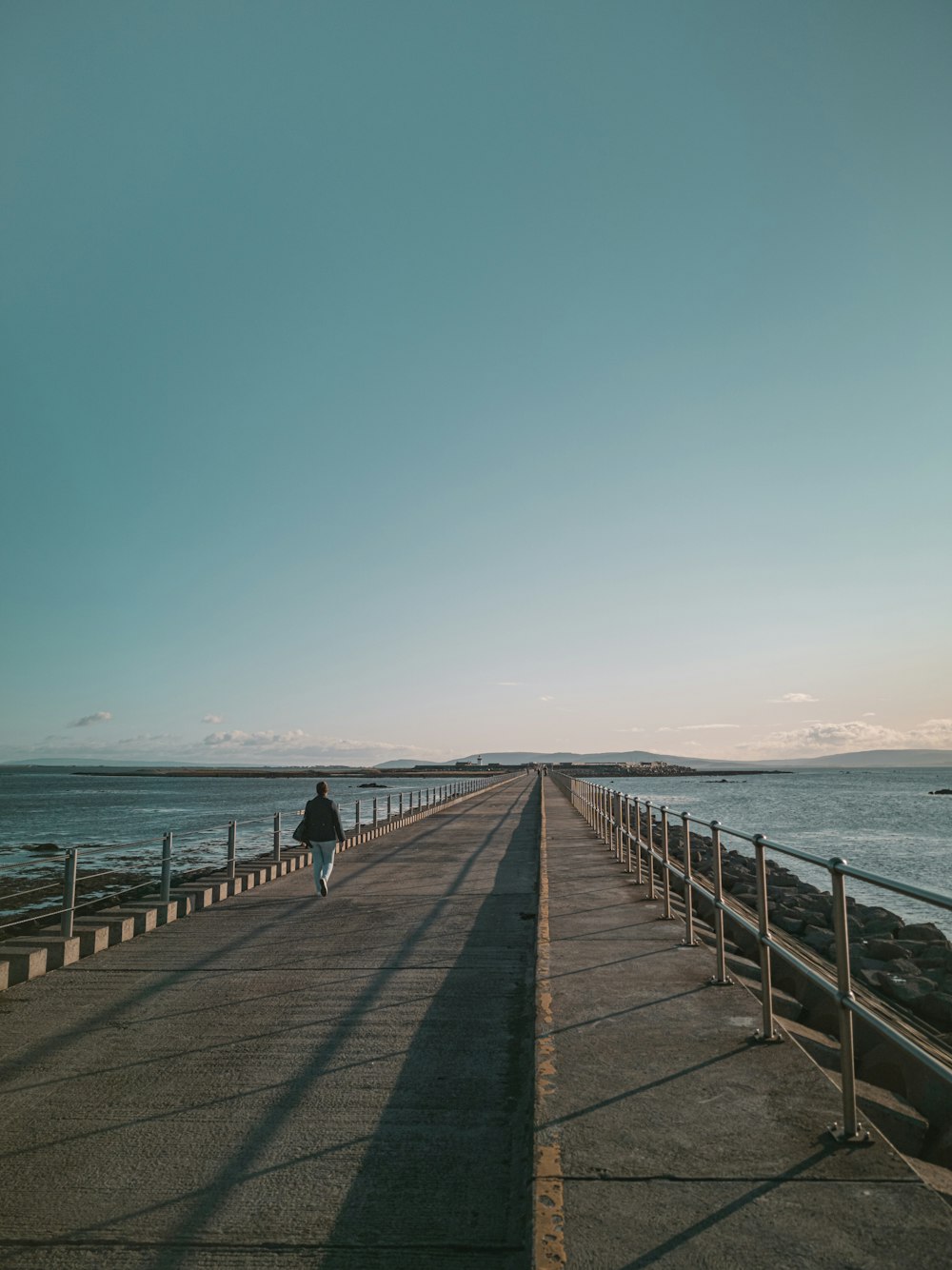 people walking on wooden dock during daytime