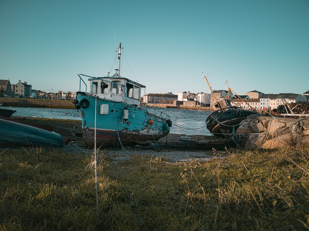 red and white boat on sea shore during daytime