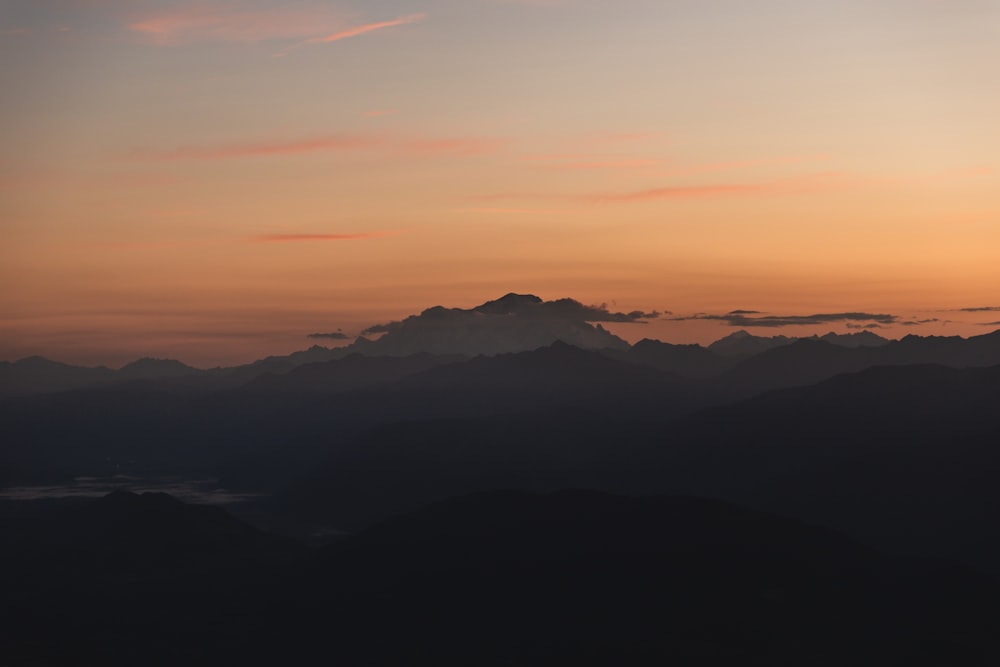 silhouette of mountains during sunset