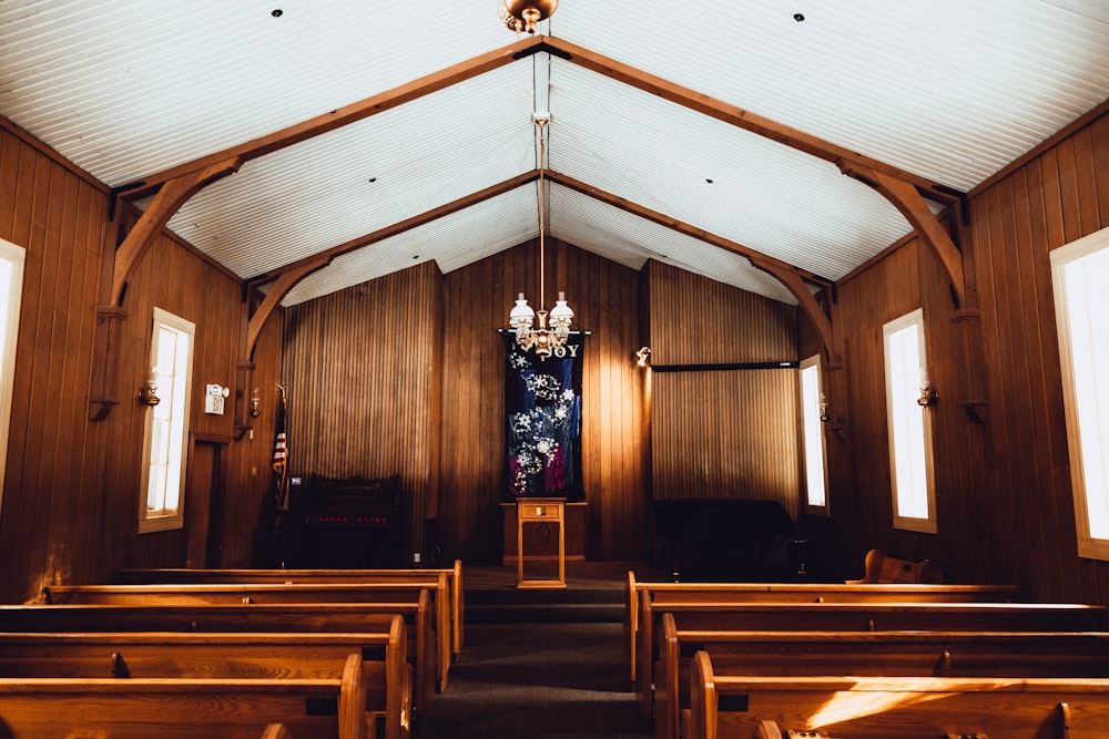 brown wooden bench inside church