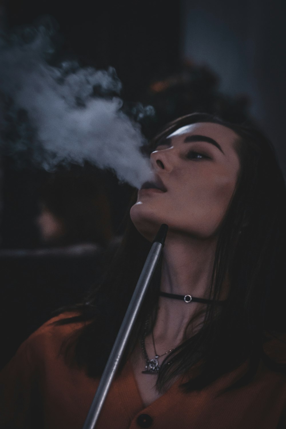 woman in black shirt smoking