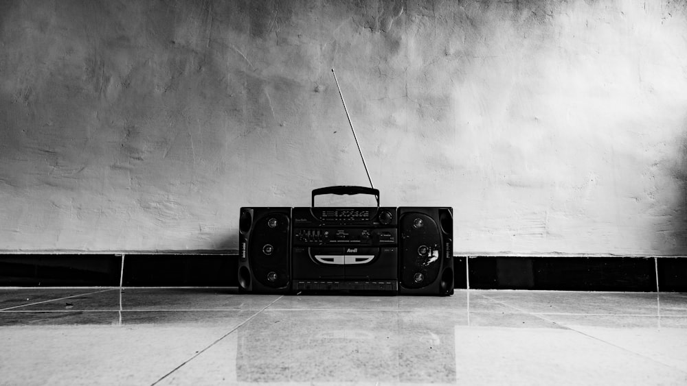 black radio on white floor tiles