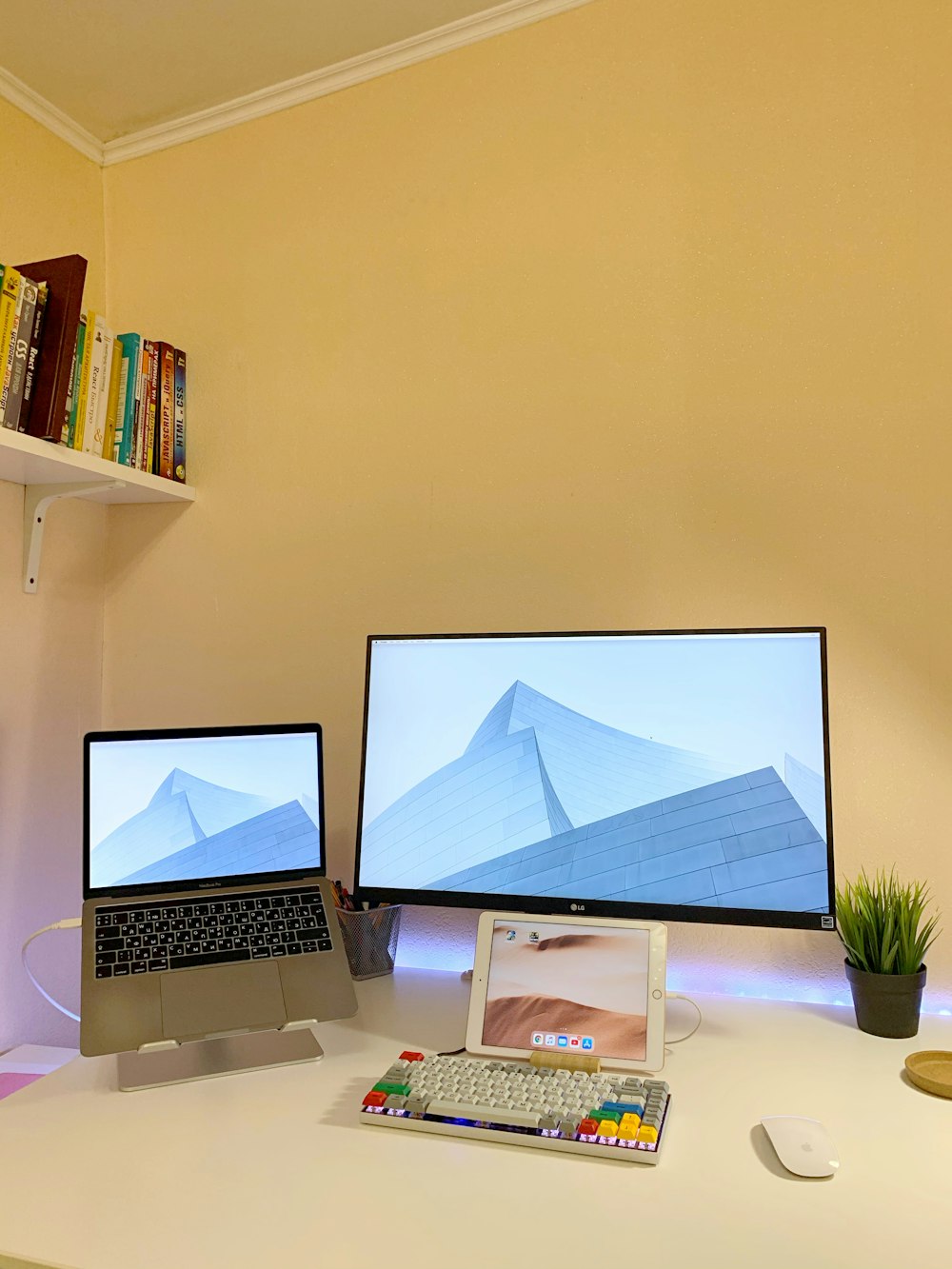 macbook pro on white table