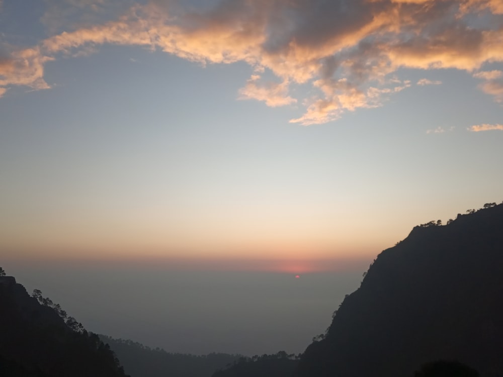 silhouette of mountain during sunset