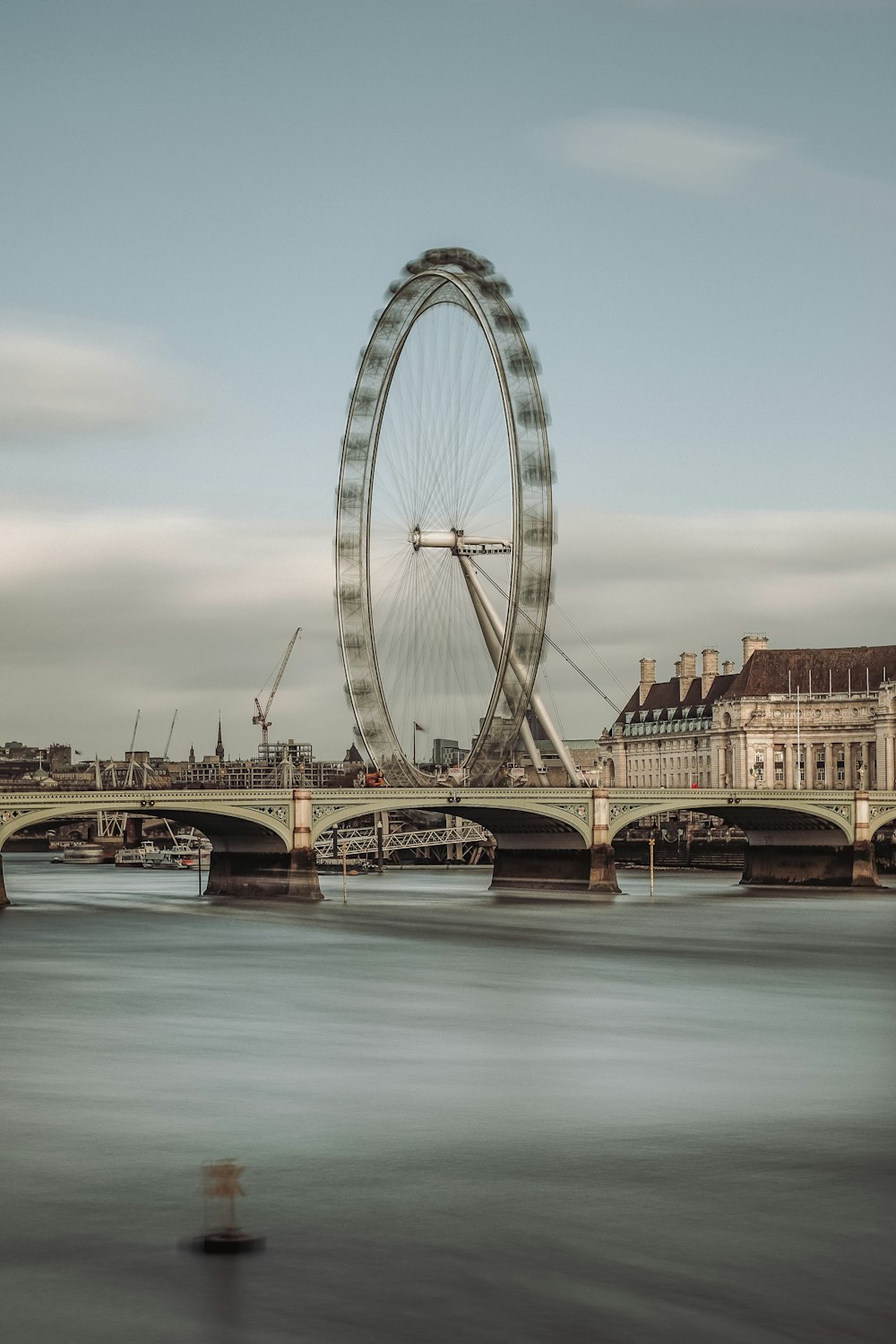 brown concrete bridge over river during daytime