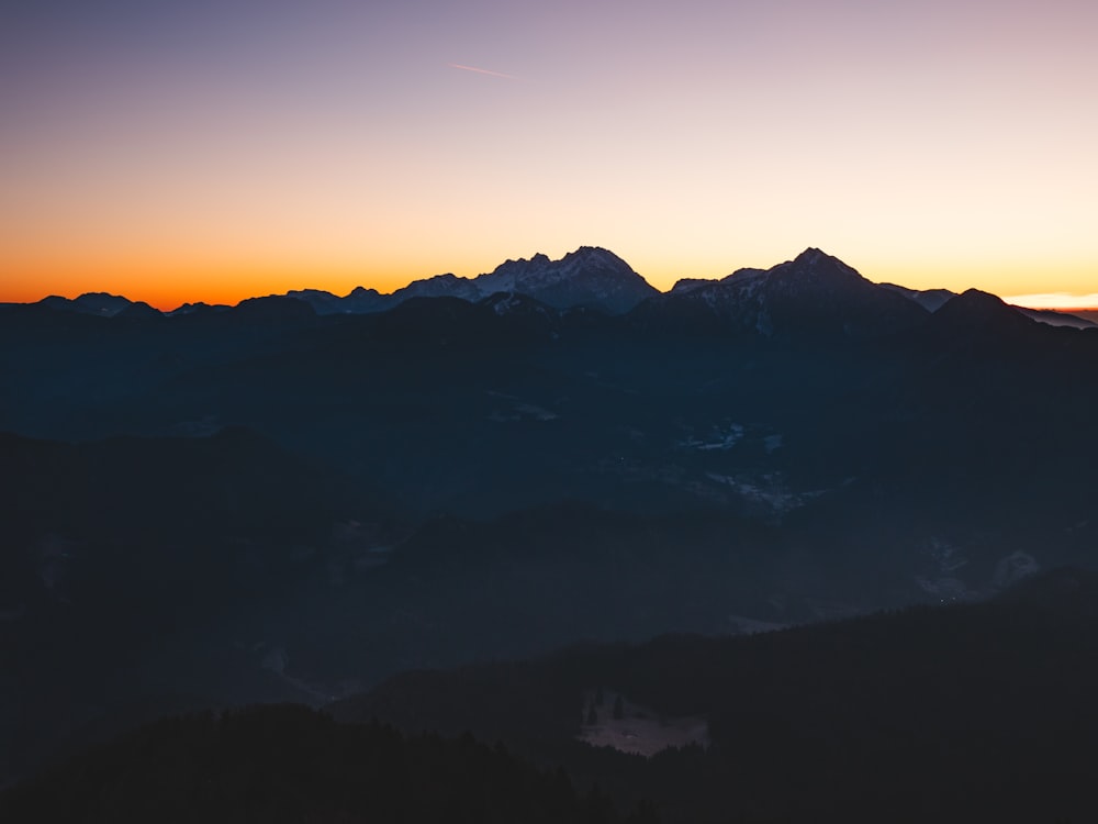 silhouette of mountains during sunset