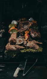 grilled meat on black charcoal grill