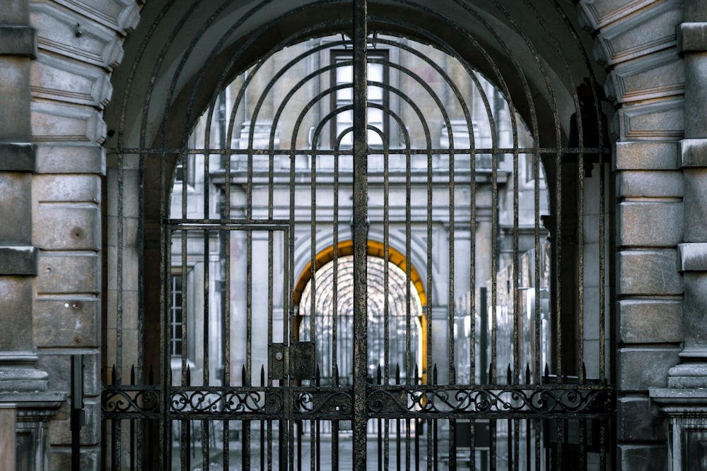 black metal gate with yellow and black arch