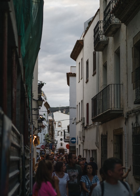 people walking on street during daytime in Tossa de Mar Spain