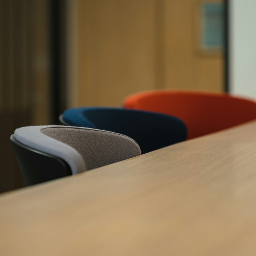 blue and gray chairs beside brown wooden table