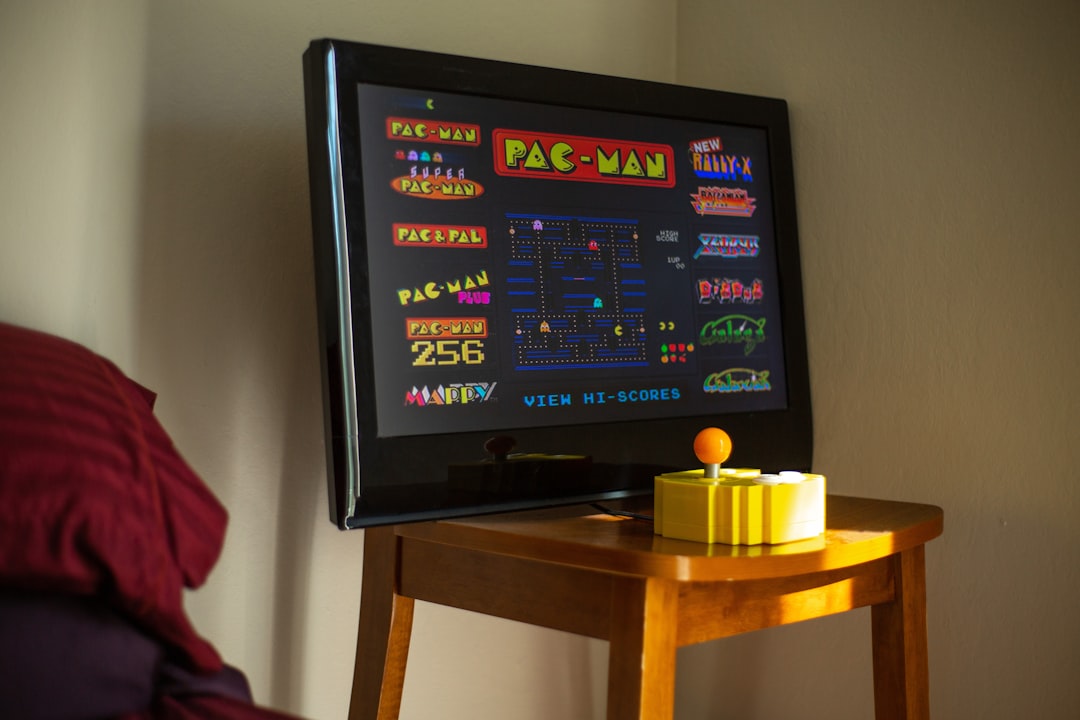 black flat screen tv on brown wooden table,