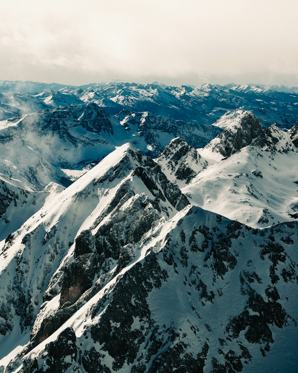 snow covered mountain under blue sky during daytime