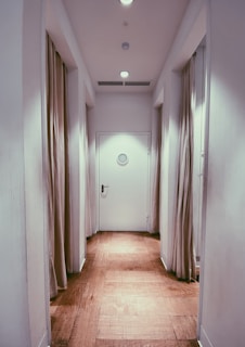 brown wooden parquet floor with white wall paint