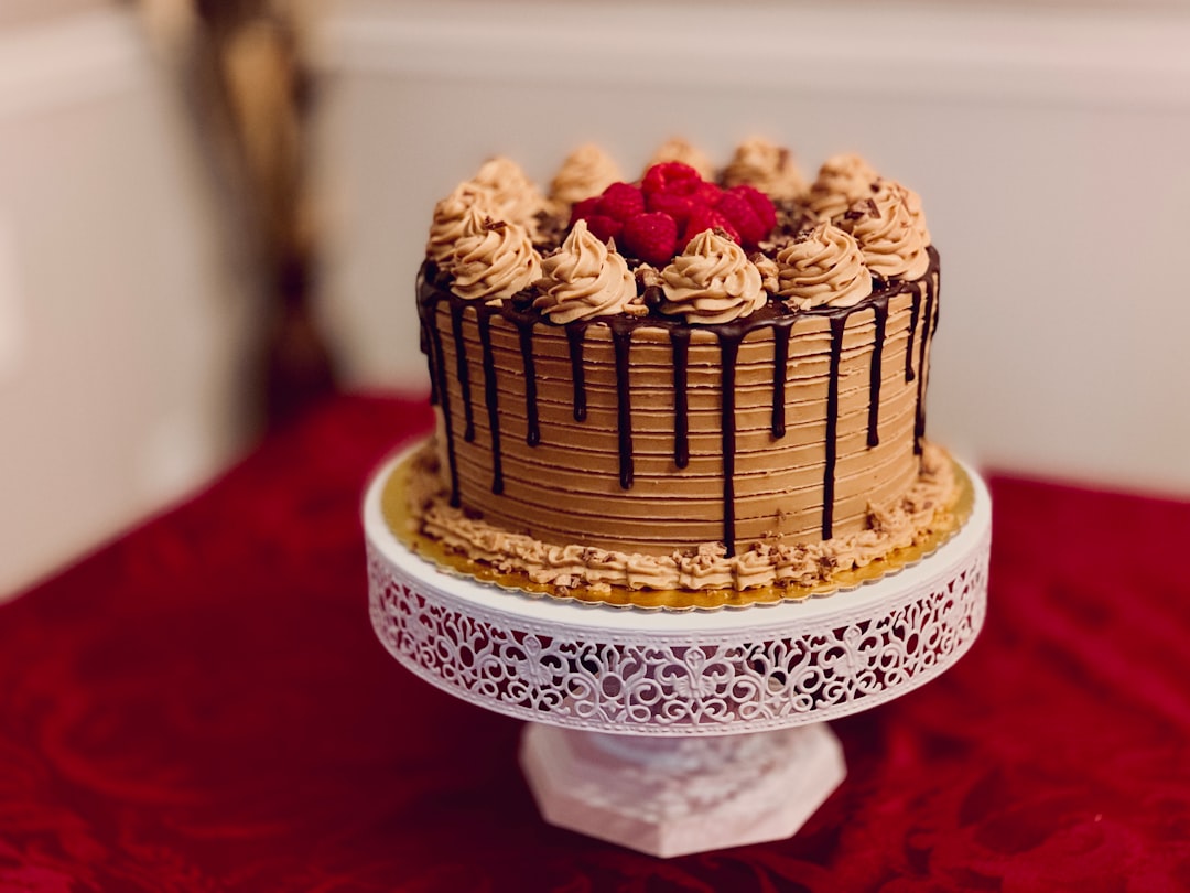 brown and white cake on white cake stand