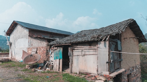 white and brown wooden house under blue sky during daytime