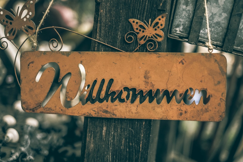 brown wooden fence with love text