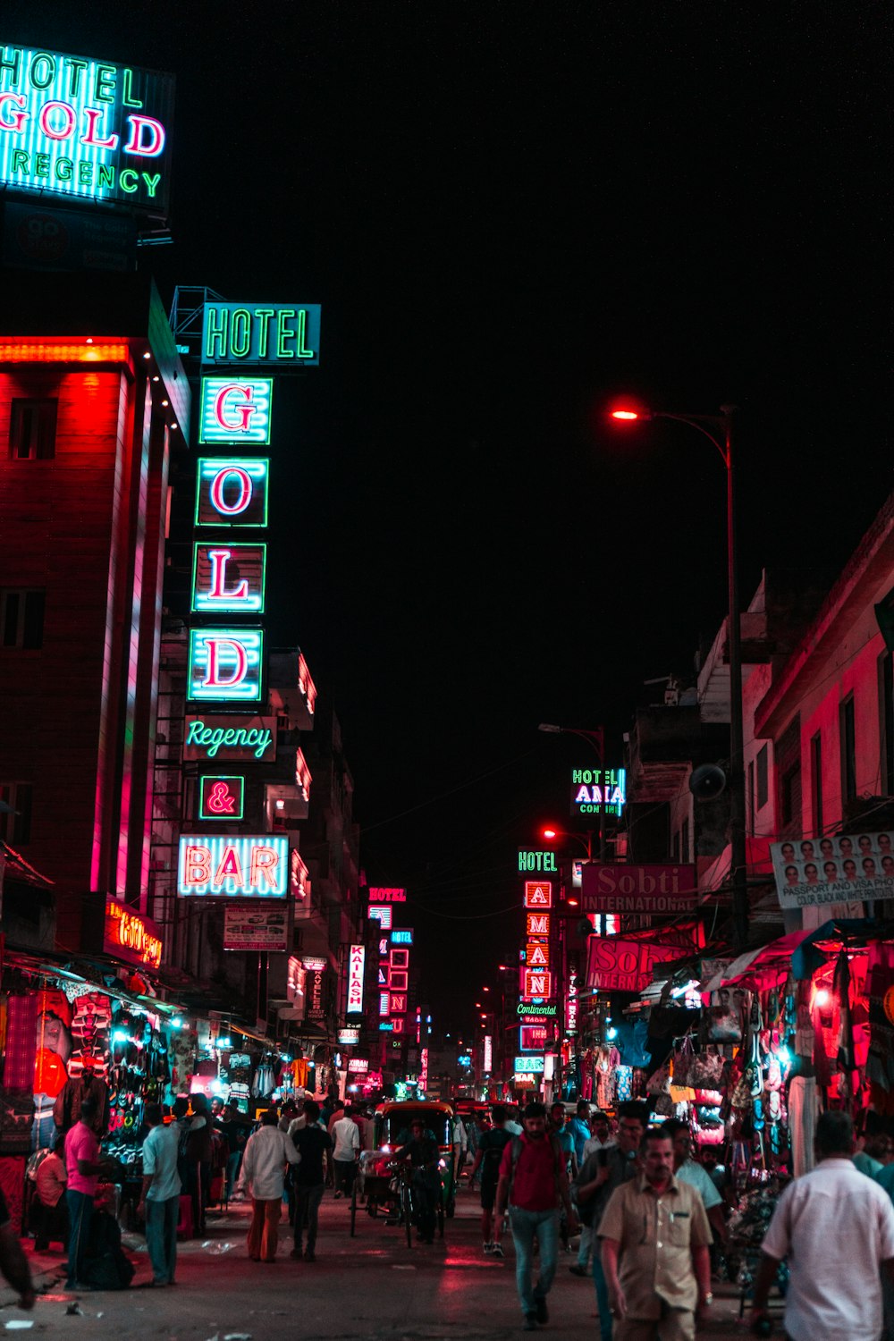 people walking on street during night time