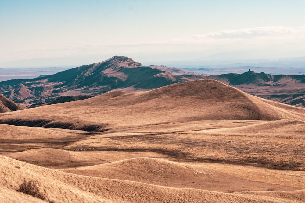 brown mountain under blue sky during daytime