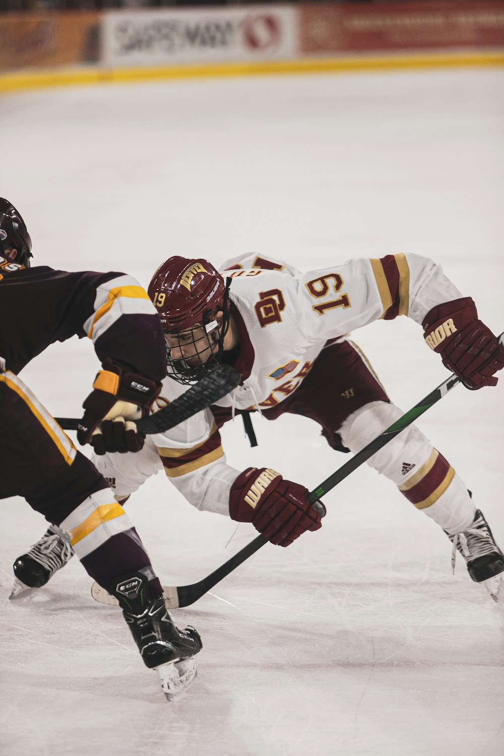 2 men playing ice hockey