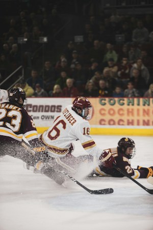 Ice hockey players skating on an indoor rink during a professional game