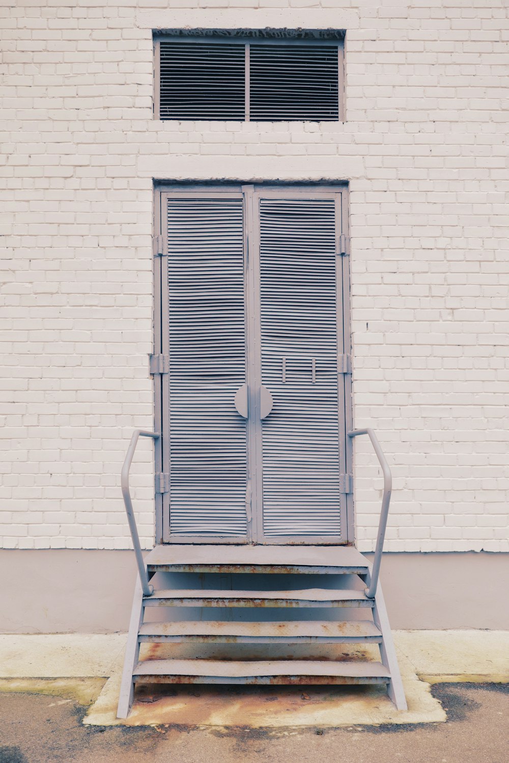 white wooden door closed during daytime