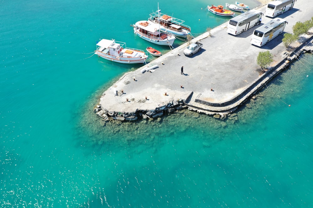 white and black yacht on sea during daytime