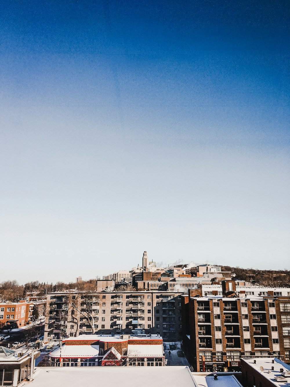 brown and white concrete buildings under blue sky during daytime