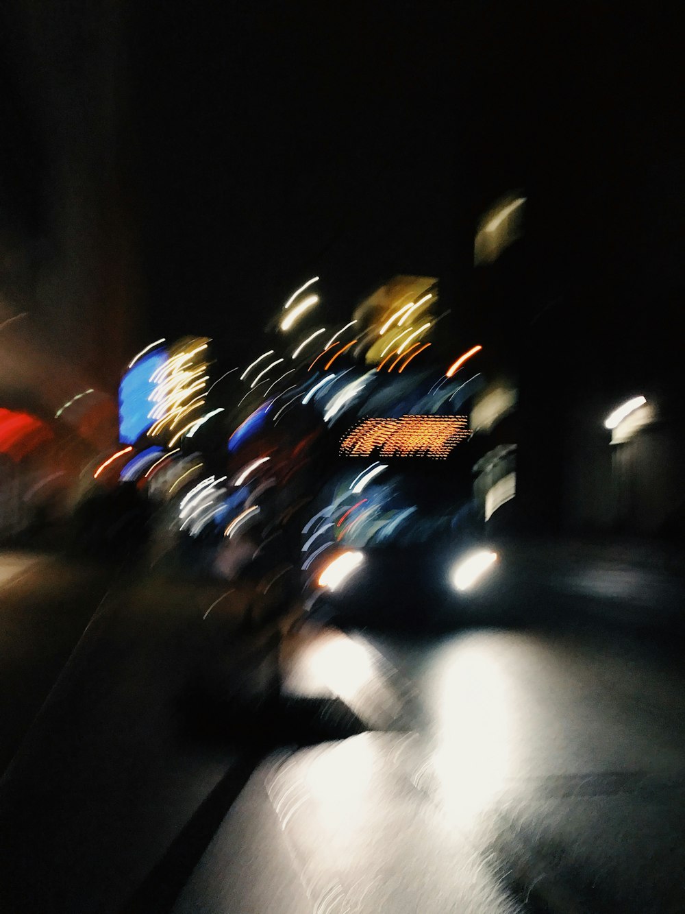 people riding motorcycle on road during nighttime