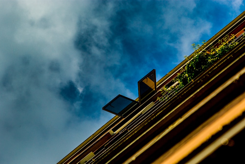 brown concrete building under blue sky