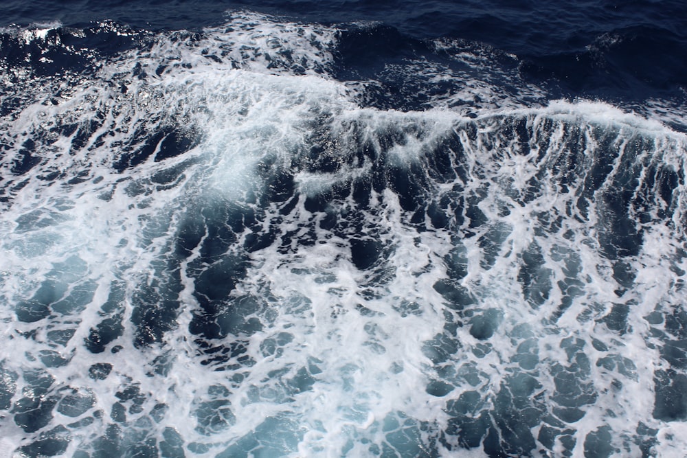 water waves on blue ocean water during daytime