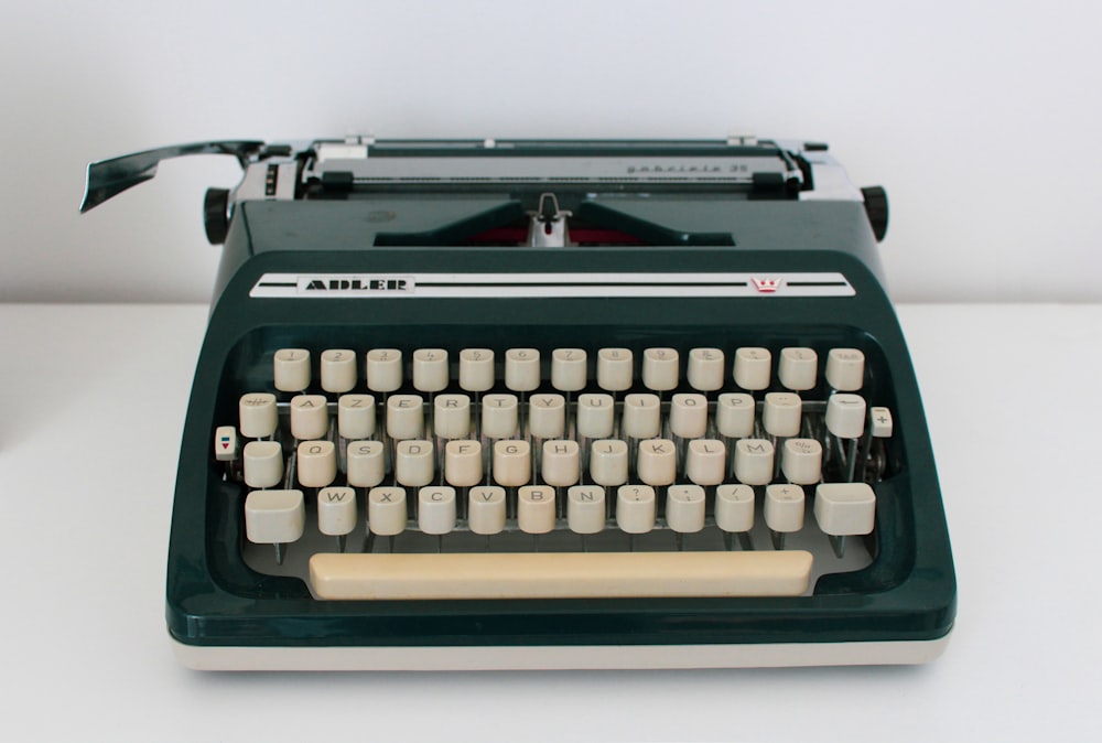 black and white typewriter on white table