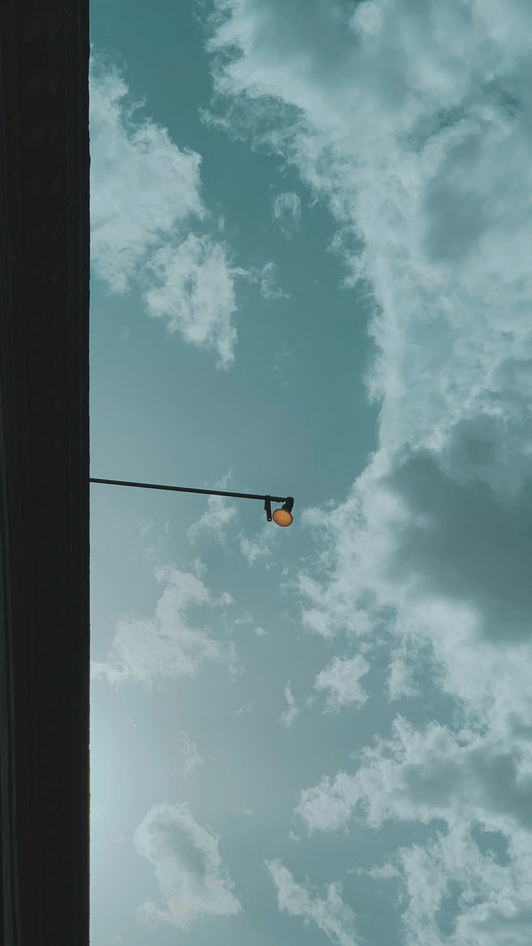 yellow light bulb under blue sky