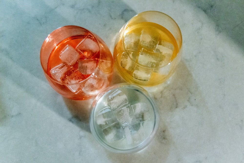 clear glass jar with yellow round medication pills