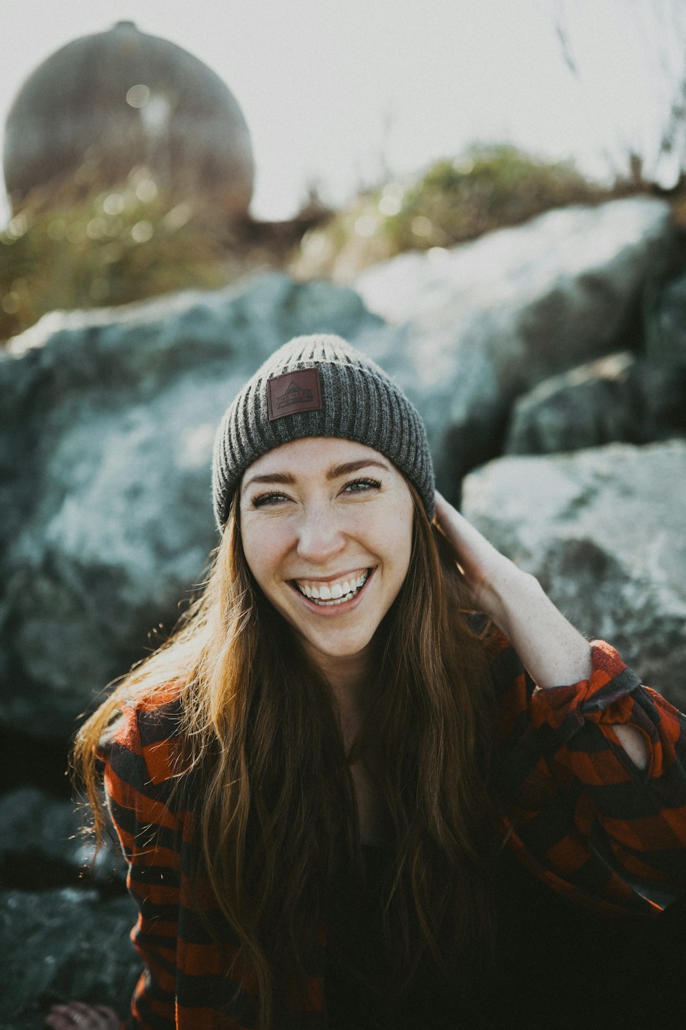 woman in black knit cap smiling