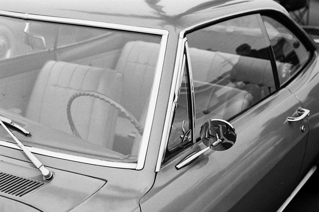 grayscale photo of car door