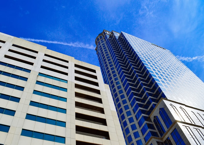 white and blue concrete building under blue sky during daytime