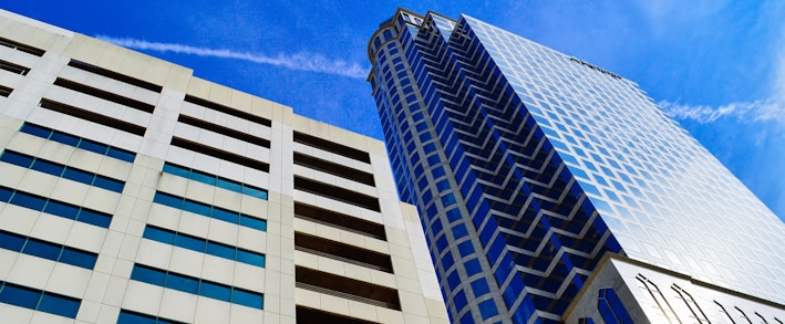 white and blue concrete building under blue sky during daytime