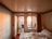 A cozy hotel room featuring elegant decor and a view of the ocean.