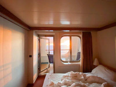 Cozy luxury suite with elegant decor and soft ocean-blue accents.