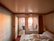 A cozy hotel room featuring elegant decor and a view of the ocean.