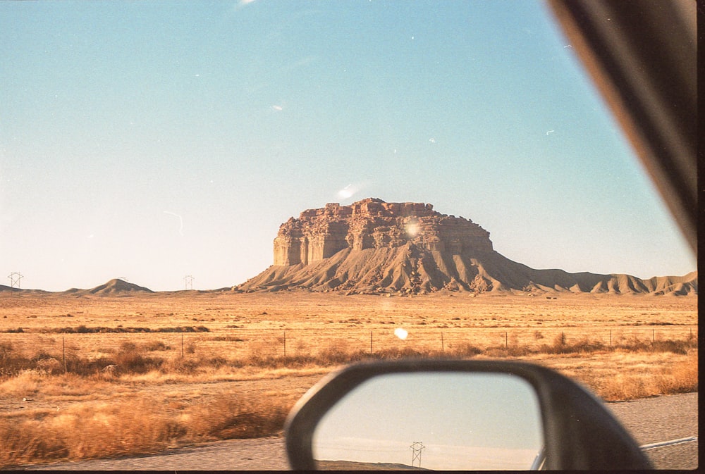 brown rocky mountain under blue sky during daytime