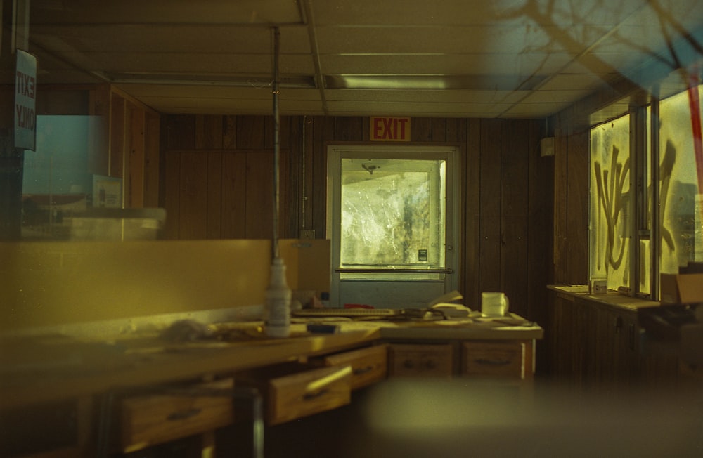 brown wooden table near window