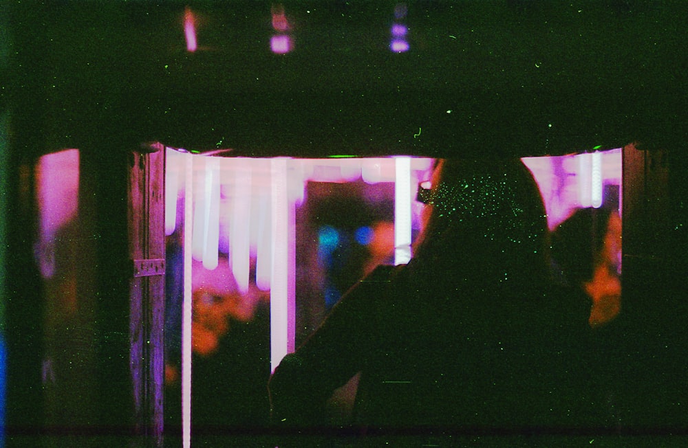 silhouette of woman in front of window