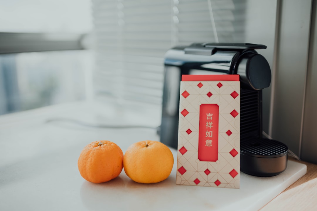 orange fruit on white and red checkered box