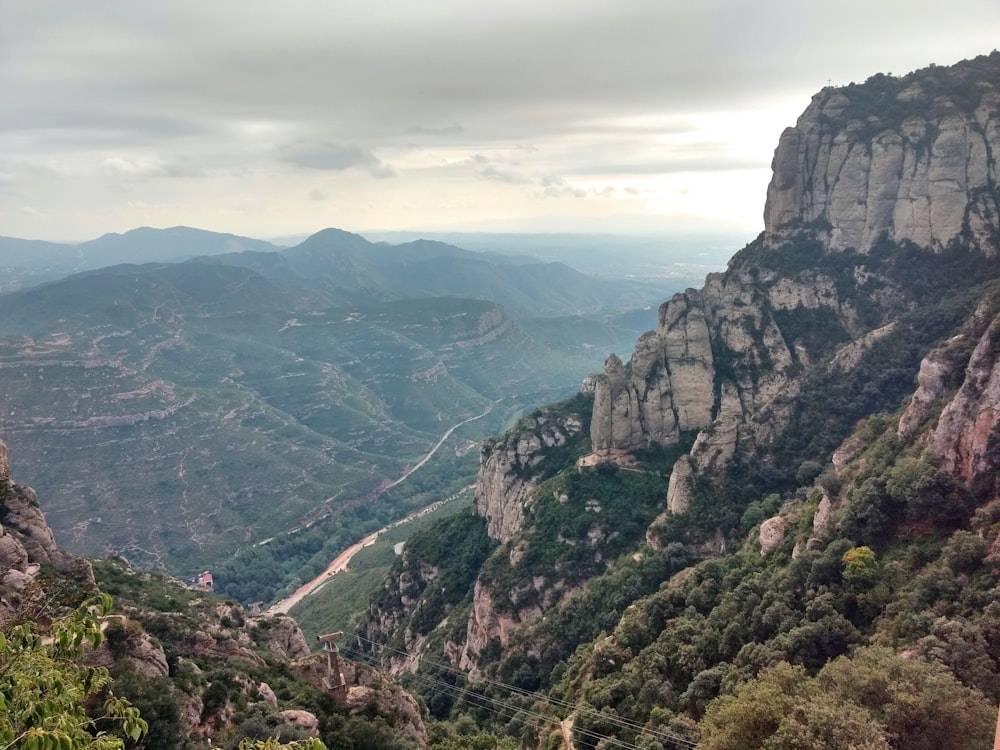 green and brown mountains under white clouds during daytime