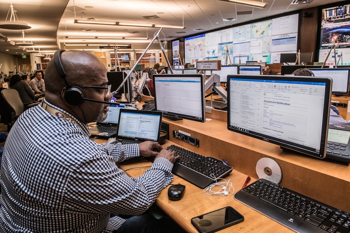 A man tries to manage calls. Busy organizations like the one he works for can invest in easy-to-use call management software.