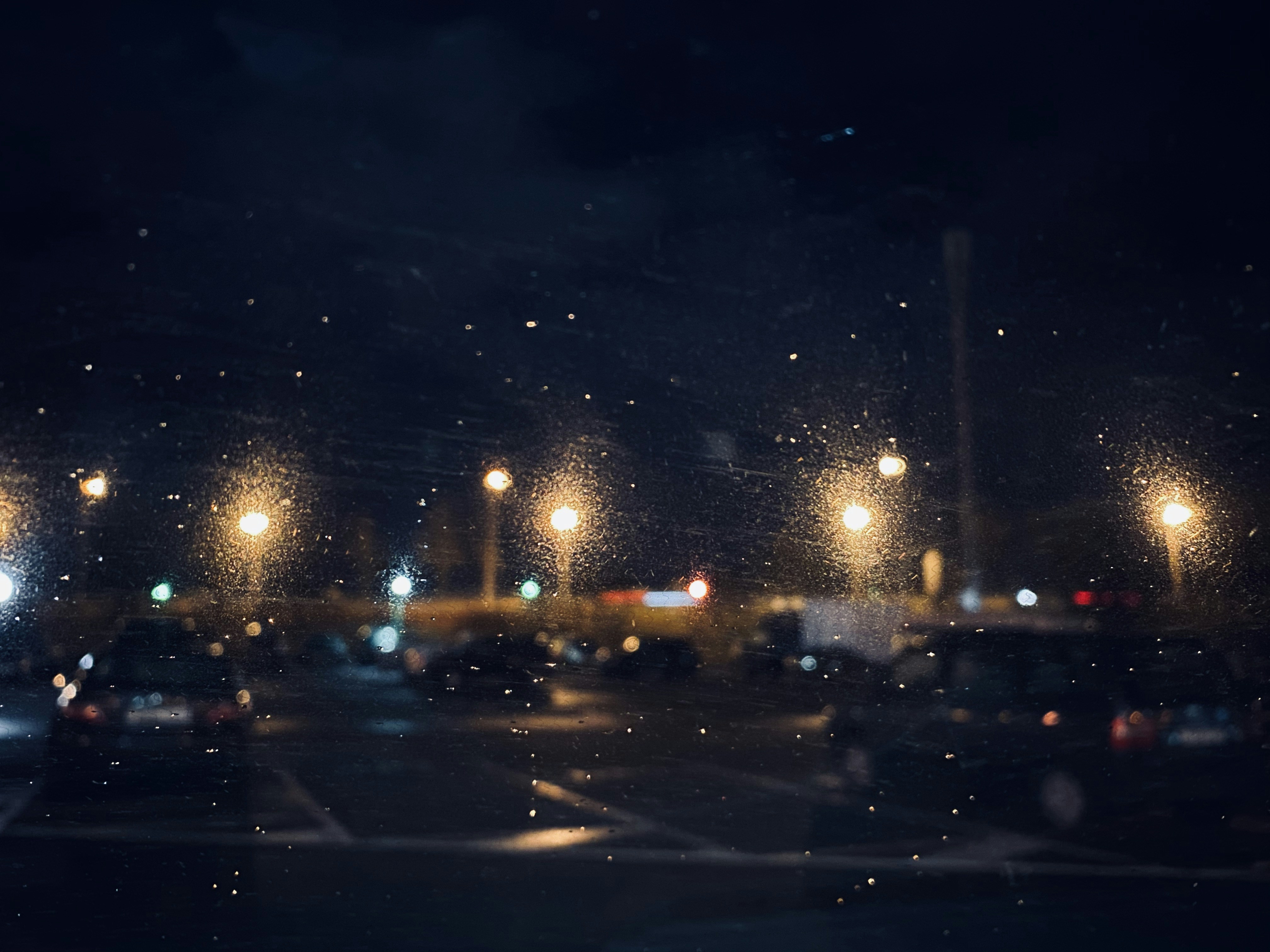 Night lights through a windshield