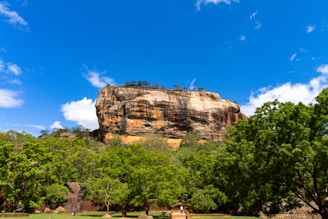 brown rock formation under blue sky during daytime